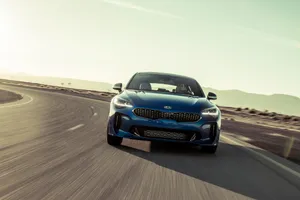 Sleek And Stylish Kia Stinger On The Road Wallpaper