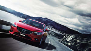 Sleek And Stylish Mazda 6 In Vibrant City Setting Wallpaper