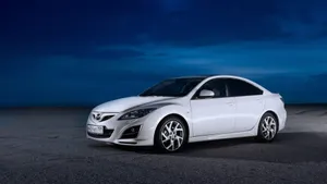 Sleek And Stylish Mazda 6 On Open Road Wallpaper