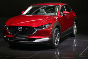 Sleek And Stylish Mazda Cx-30 In Urban Setting Wallpaper