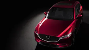 Sleek And Stylish Mazda Cx-5 On A Scenic Road Wallpaper