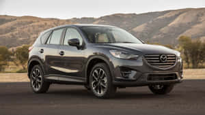 Sleek And Stylish Mazda Cx-5 On The Road Wallpaper