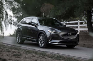 Sleek And Stylish Mazda Cx-9 In Action Wallpaper