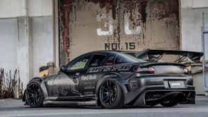 Sleek And Stylish Mazda Rx-8 In Action Wallpaper