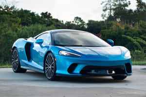 Sleek And Stylish Mclaren Gt On The Road Wallpaper