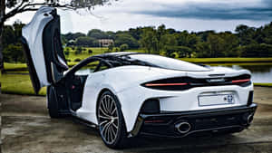 Sleek And Stylish Mclaren Gt On The Road Wallpaper