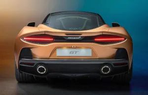 Sleek And Stylish Mclaren Gt On The Road Wallpaper