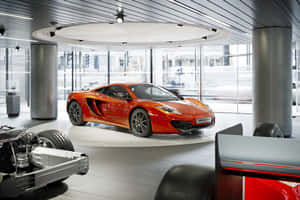 Sleek And Stylish Mclaren Mp4-12c On Open Road Wallpaper