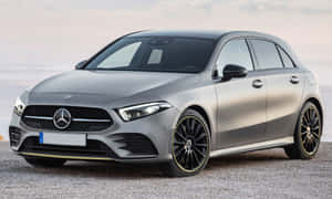 Sleek And Stylish Mercedes-benz A-class On A Scenic Drive Wallpaper