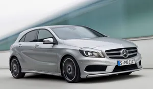 Sleek And Stylish Mercedes Benz A-class On The Road Wallpaper