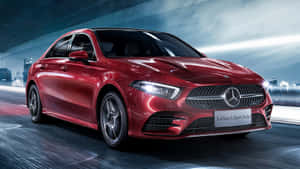 Sleek And Stylish Mercedes Benz A-class On The Road Wallpaper