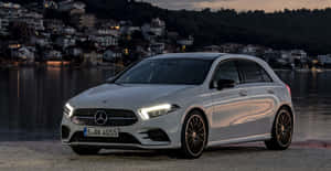 Sleek And Stylish Mercedes-benz A-class On The Road Wallpaper