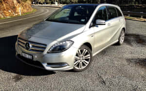 Sleek And Stylish Mercedes Benz B-class In A Cityscape Wallpaper