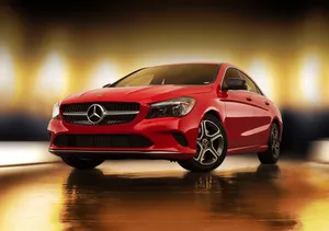 Sleek And Stylish Mercedes Benz Cla-class In Motion Wallpaper