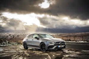 Sleek And Stylish Mercedes Benz Cla-class In Motion Wallpaper