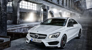 Sleek And Stylish Mercedes Benz Cla-class On The Road Wallpaper