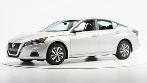 Sleek And Stylish Nissan Altima On The Road Wallpaper