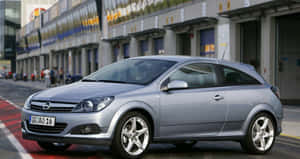 Sleek And Stylish Opel Astra In Motion Wallpaper