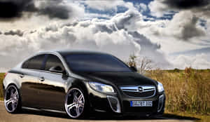 Sleek And Stylish Opel Insignia On The Road Wallpaper