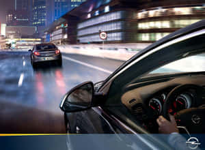 Sleek And Stylish Opel Insignia On The Road Wallpaper