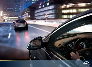 Sleek And Stylish Opel Insignia On The Road Wallpaper