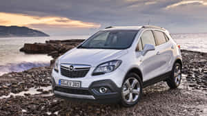 Sleek And Stylish Opel Mokka On The Road Wallpaper