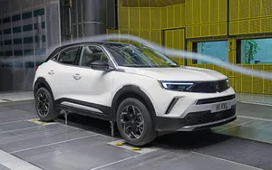 Sleek And Stylish Opel Mokka On The Road Wallpaper