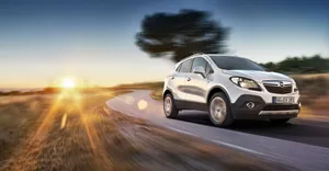 Sleek And Stylish Opel Mokka On The Road Wallpaper
