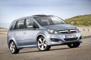 Sleek And Stylish Opel Zafira In Motion Wallpaper