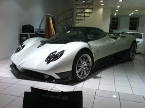 Sleek And Stylish Pagani Zonda C12 Roadster On The Open Road Wallpaper