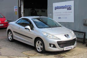 Sleek And Stylish Peugeot 207 In Action Wallpaper