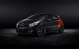 Sleek And Stylish Peugeot 208 In Action Wallpaper