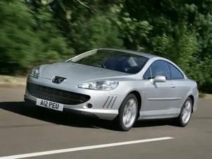 Sleek And Stylish Peugeot 407 In Full Speed Wallpaper