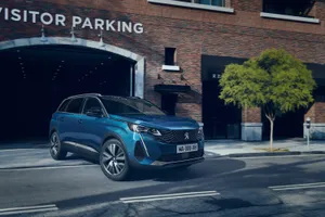 Sleek And Stylish Peugeot 5008 On Open Road Wallpaper