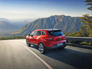 Sleek And Stylish Renault Kadjar In A Dramatic Nature Backdrop Wallpaper