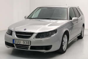 Sleek And Stylish Saab 9-5 In Natural Backdrop Wallpaper