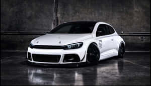 Sleek And Stylish Tuned Car Showcased At Night Wallpaper