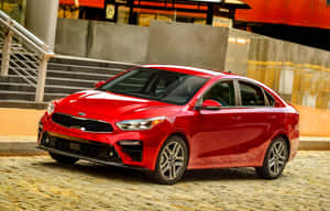 Sleek And Stylish Urban Driving With The Kia Forte Wallpaper