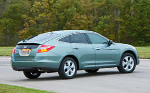 Sleek And Versatile Honda Crosstour On The Road Wallpaper