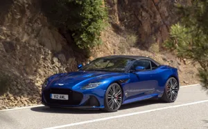 Sleek Aston Martin Dbs Superleggera On The Road Wallpaper