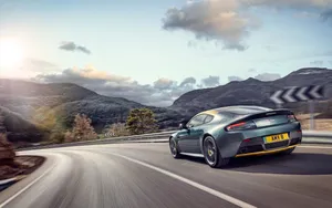 Sleek Aston Martin V12 Vantage In The Wild Wallpaper