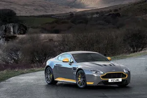Sleek Aston Martin V12 Vantage On The Open Road Wallpaper