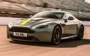 Sleek Aston Martin V12 Vantage Showcasing Its Power And Elegance Wallpaper