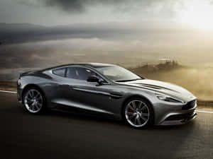 Sleek Aston Martin Vanquish In A Majestic Landscape Wallpaper