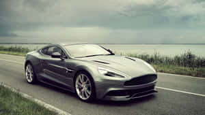 Sleek Aston Martin Vanquish In Action Wallpaper