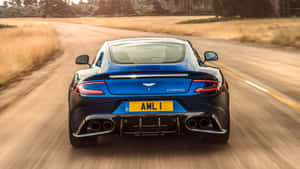 Sleek Aston Martin Vanquish In Motion Wallpaper