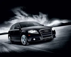 Sleek Audi A3 On A Scenic Drive Wallpaper
