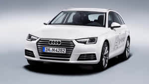 Sleek Audi A4 Showcasing Its Elegant Design And Sophistication On The City Streets. Wallpaper