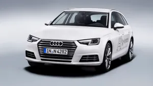 Sleek Audi A4 Showcasing Its Elegant Design And Sophistication On The City Streets. Wallpaper