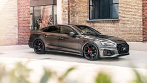 Sleek Audi A5 In A Stunning Urban Setting Wallpaper